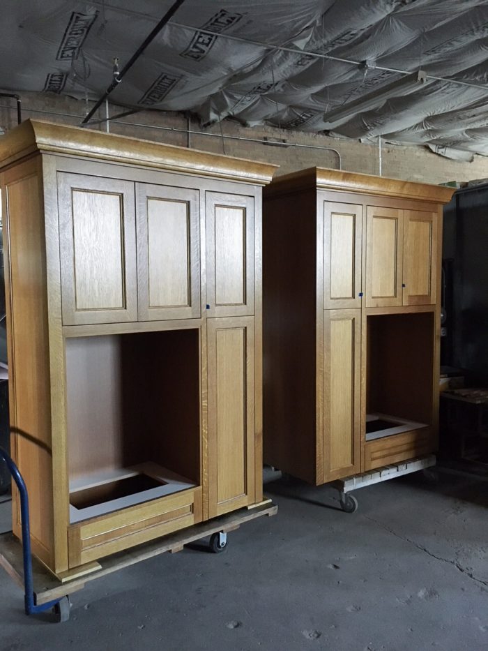 This set of cabinets will go on to house a mail center for a condo building lobby.  The large opening will house  traditional aluminum mail box lockers. Quartersawn white oak with custom stain.